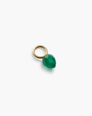 Gold hoop with green gemstone charm on a white background