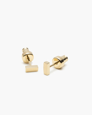 Pair of gold-tone flat-back bar stud earrings, on a white background.