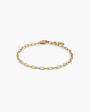 Gold textured link chain bracelet on a white background