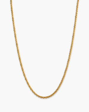 Gold twisted rope chain necklace on white background