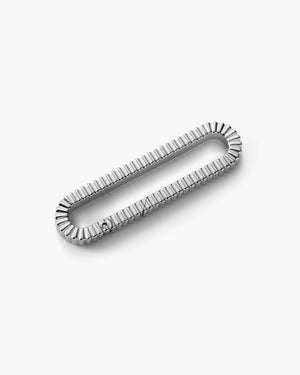 Silver textured oval drop pendant with a ribbed design, laid flat on a white background.