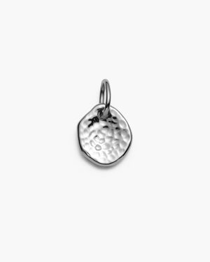 Silver hammered coin charm on a white background