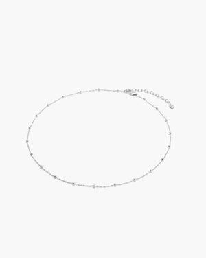 Fine chain necklace with spaced out beaded necklace in silver